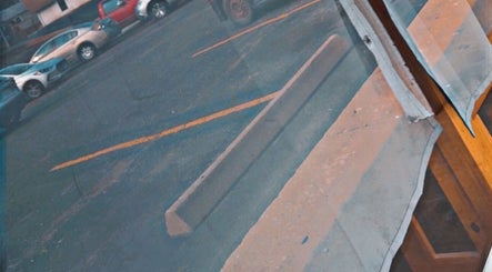 View from Wolfy’s Barbershop window showing street in Sedalia, Missouri, US.