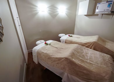 Cozy massage room at Massage In LA, Los Angeles, California, US with two beds and elegant decor.