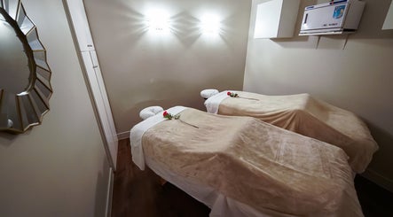 Cozy massage room at Massage In LA, Los Angeles, California, US with two beds and elegant decor.