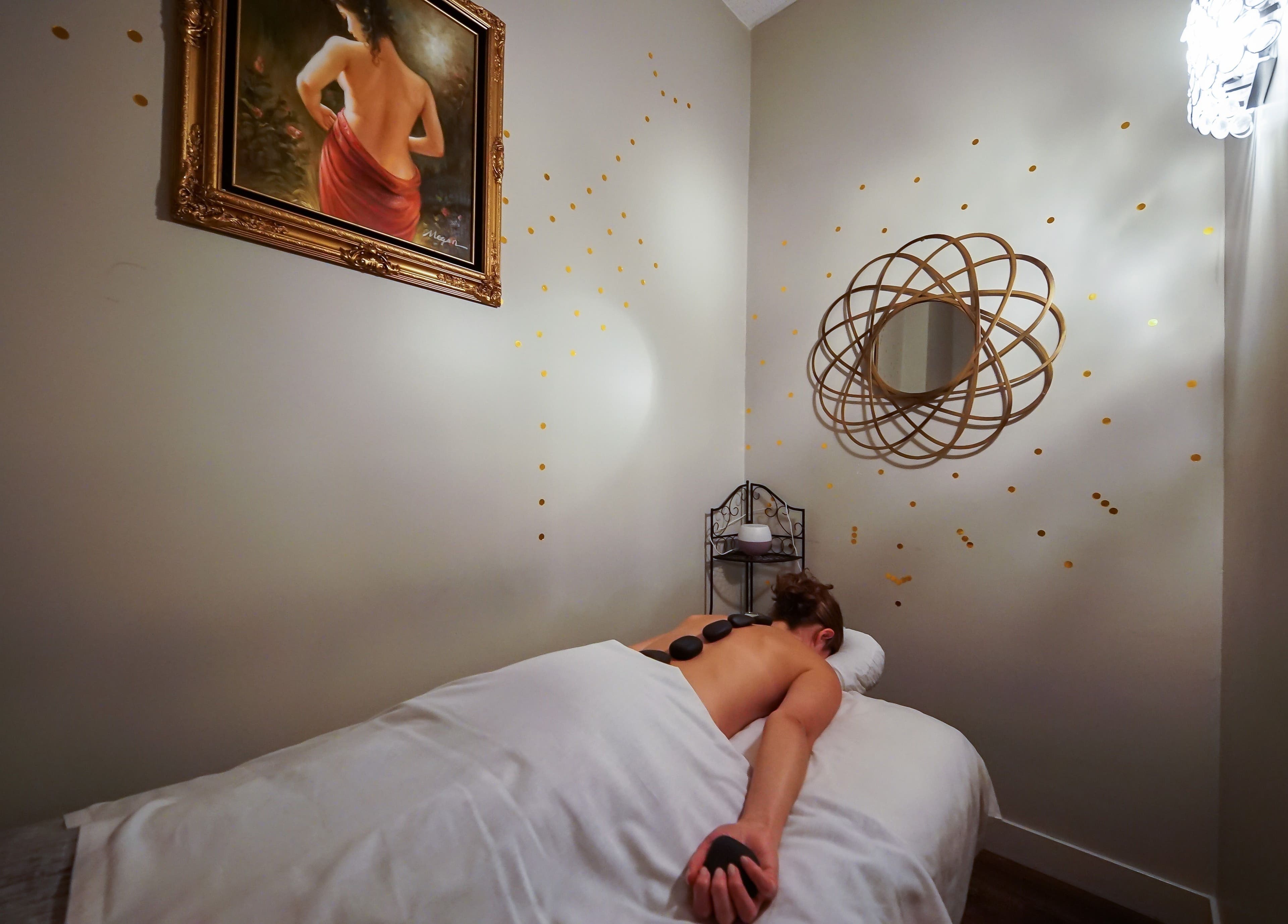 Relaxing hot stone massage at Massage In LA, Los Angeles, California, US. Calm ambiance with elegant decor.