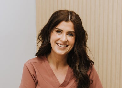 Smiling wellness professional at Bloom Integral Wellness, Melbourne, Victoria, AU.