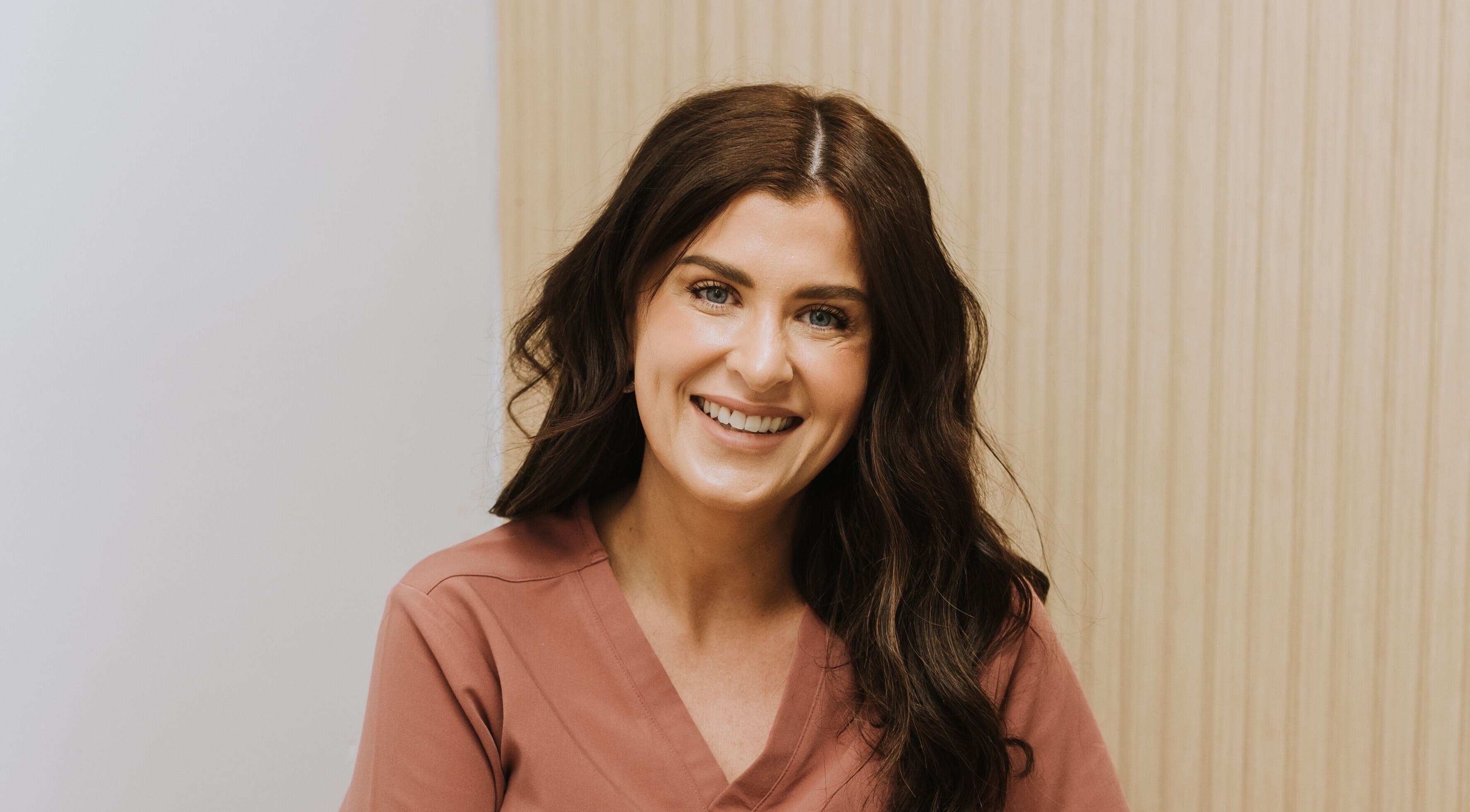 Smiling wellness professional at Bloom Integral Wellness, Melbourne, Victoria, AU.