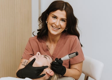 Therapist at Bloom Integral Wellness, Melbourne, Victoria, AU, providing facial treatment.