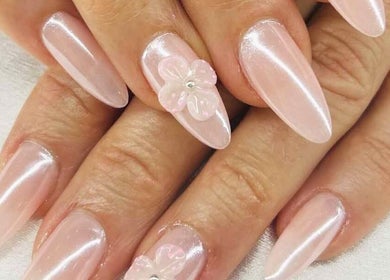 Glamorous pearl nails with floral accents at Venice Nail Bar, Algonquin, Illinois, US.
