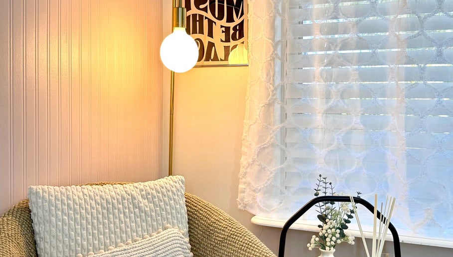 Inviting reading nook at Luxxe Beauty Cosmetics, Eaton, Western Australia, featuring soft lighting and decor.