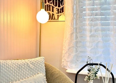 Inviting reading nook at Luxxe Beauty Cosmetics, Eaton, Western Australia, featuring soft lighting and decor.