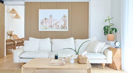 Stylish lounge area at Sydney Wide Counselling, Stanmore, New South Wales, AU with a cozy white sofa and plants.