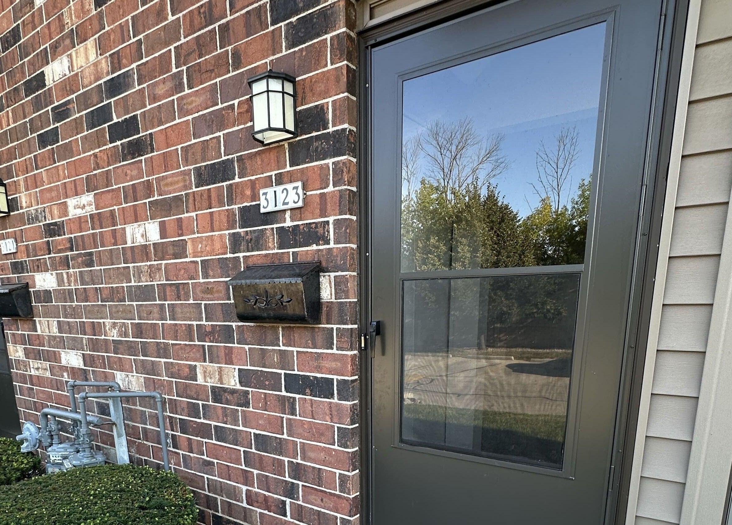 Elegant brick entrance of M&D Grooming, Greenfield, Wisconsin, US showcasing a welcoming facade.