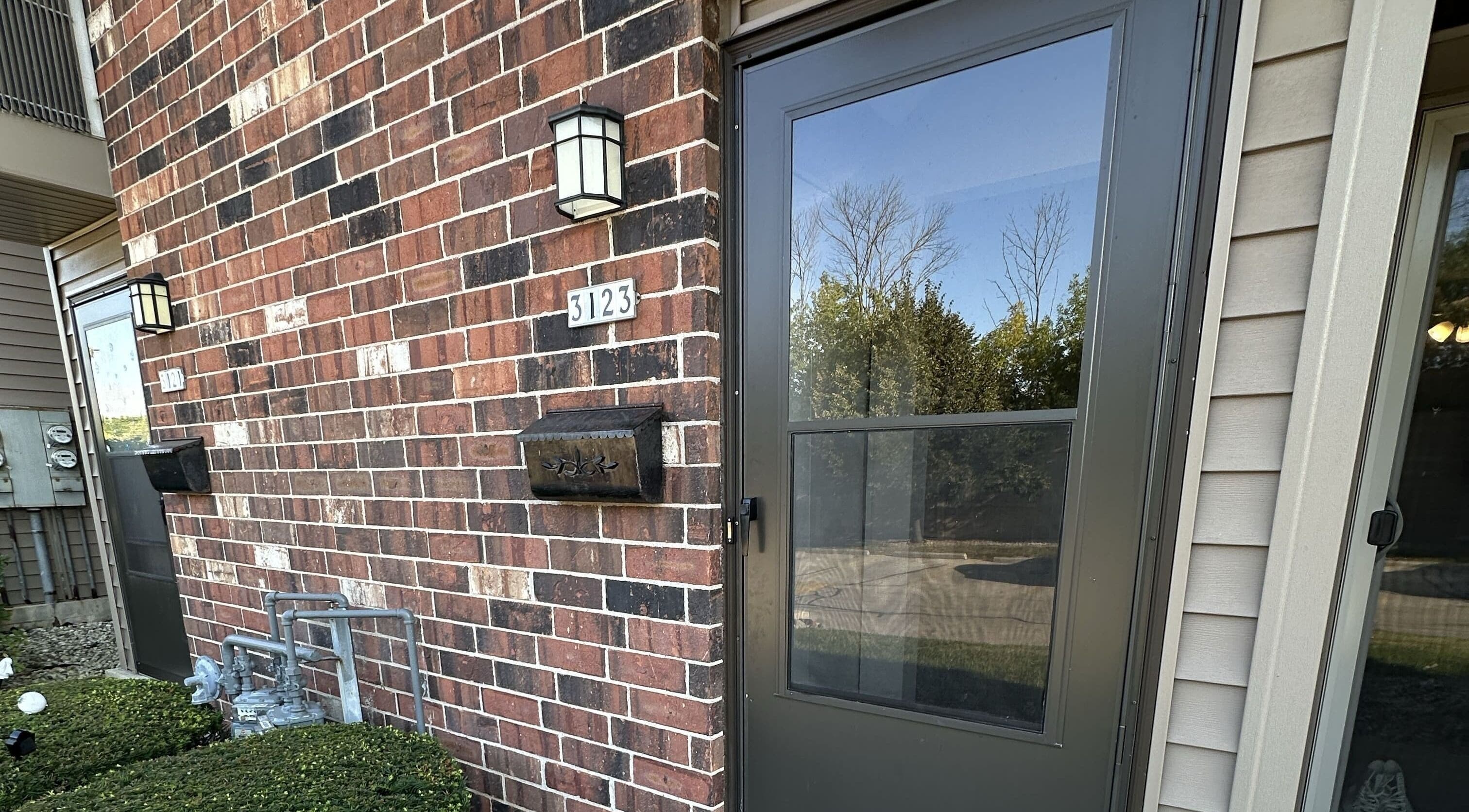 Elegant brick entrance of M&D Grooming, Greenfield, Wisconsin, US showcasing a welcoming facade.
