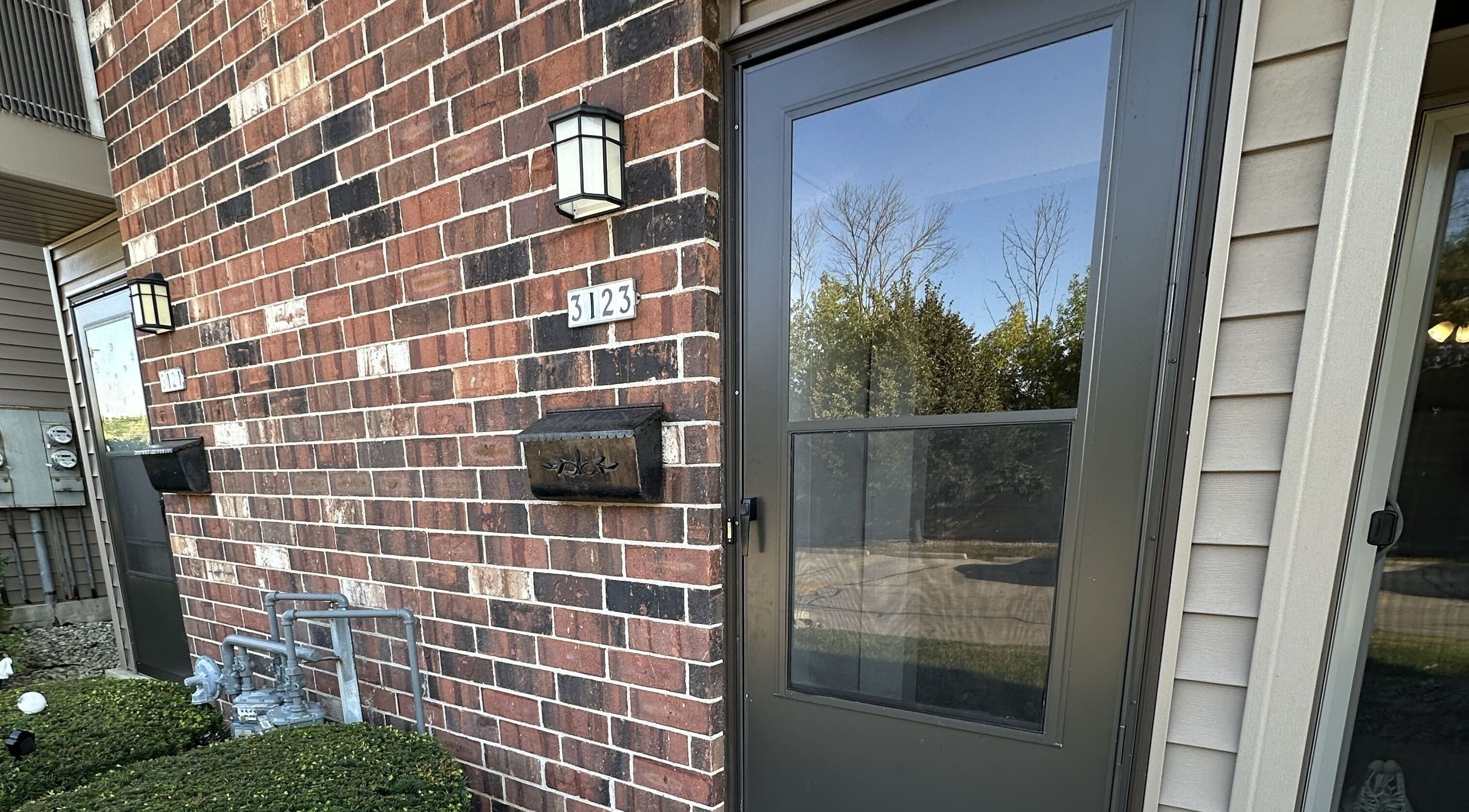 Elegant brick entrance of M&D Grooming, Greenfield, Wisconsin, US showcasing a welcoming facade.