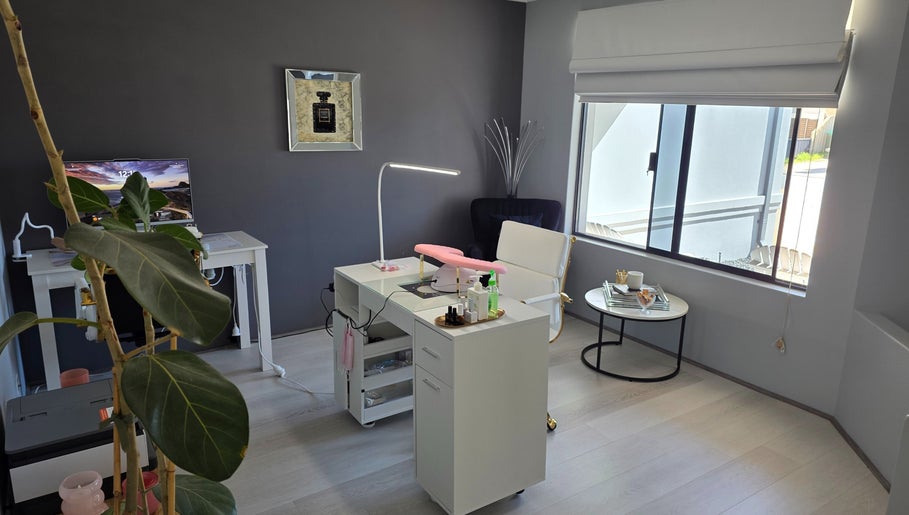 Modern nail salon interior at The Nail Edit, Butler, Western Australia, AU, featuring sleek furniture and natural light.