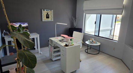 Modern nail salon interior at The Nail Edit, Butler, Western Australia, AU, featuring sleek furniture and natural light.