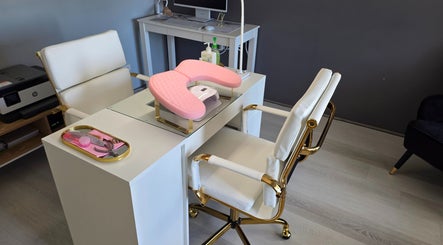 Luxury nail station at The Nail Edit, Butler, Western Australia, AU with pink armrest and manicure tools.