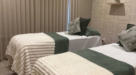 Peaceful massage beds at Hunny's Clinique PTA, Pretoria, Gauteng, ZA, with elegant decor and soft textiles.