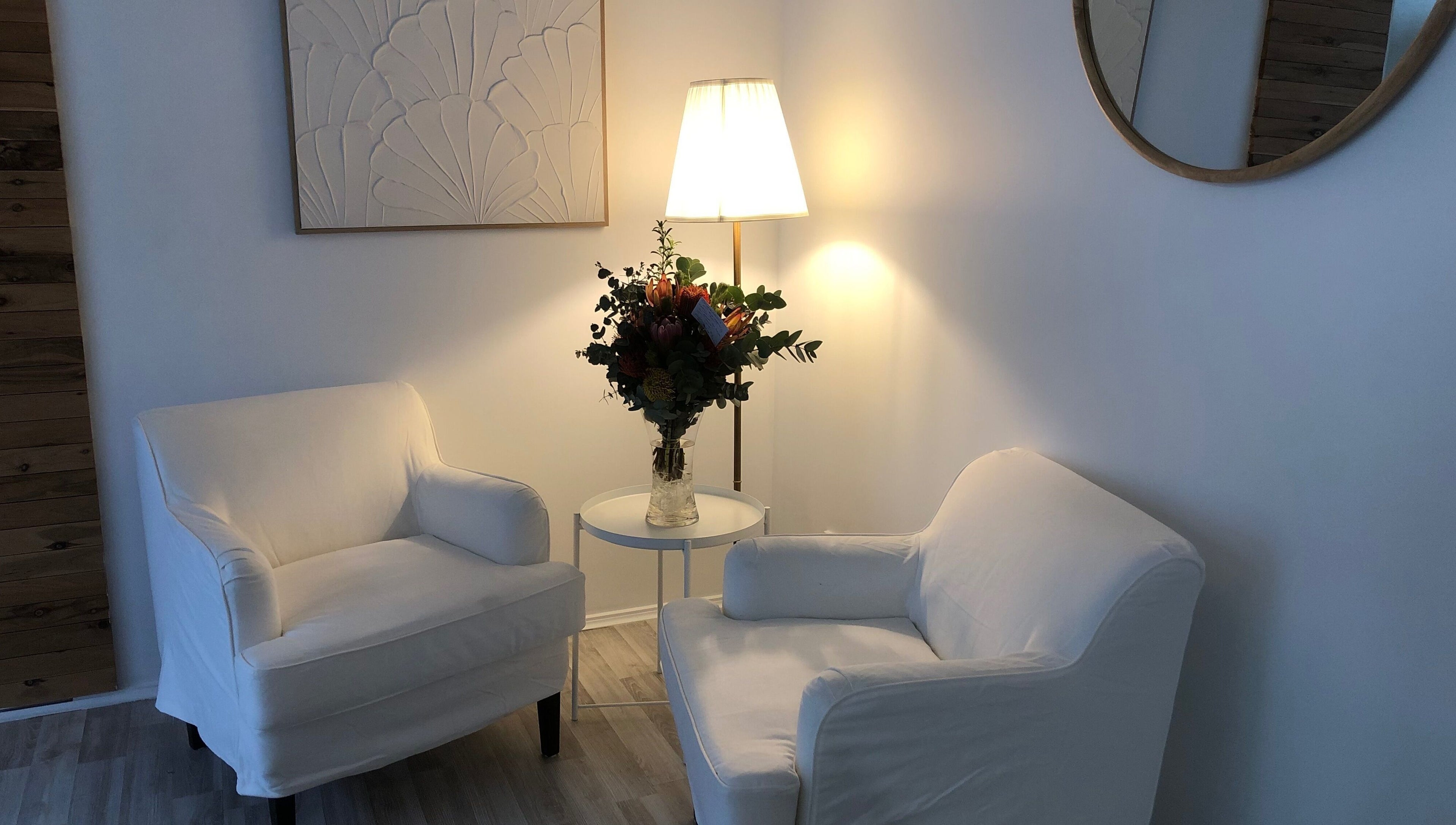 Cozy seating area at Beauty 2464 in Yamba, New South Wales, AU featuring plush chairs and elegant decor.