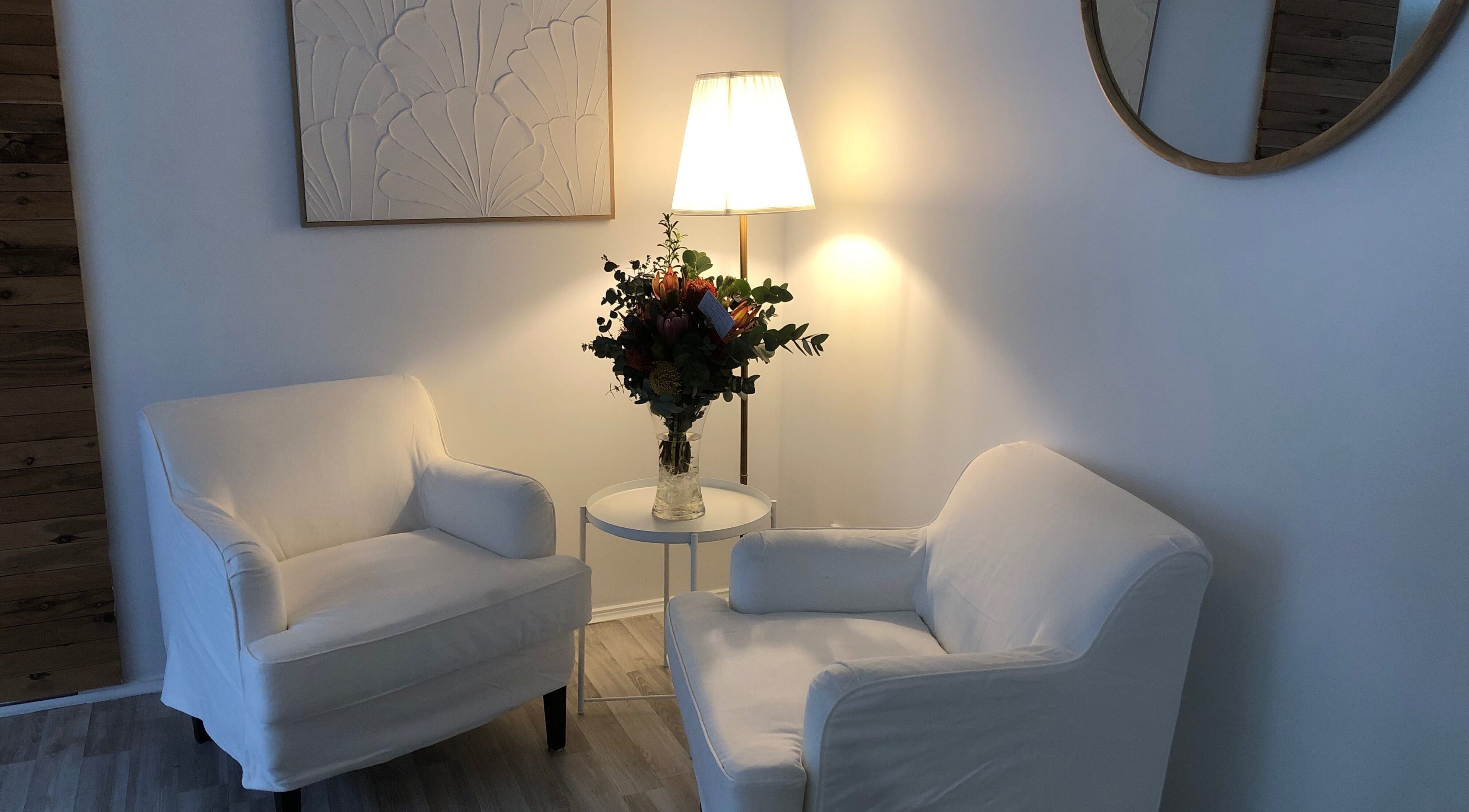 Cozy seating area at Beauty 2464 in Yamba, New South Wales, AU featuring plush chairs and elegant decor.