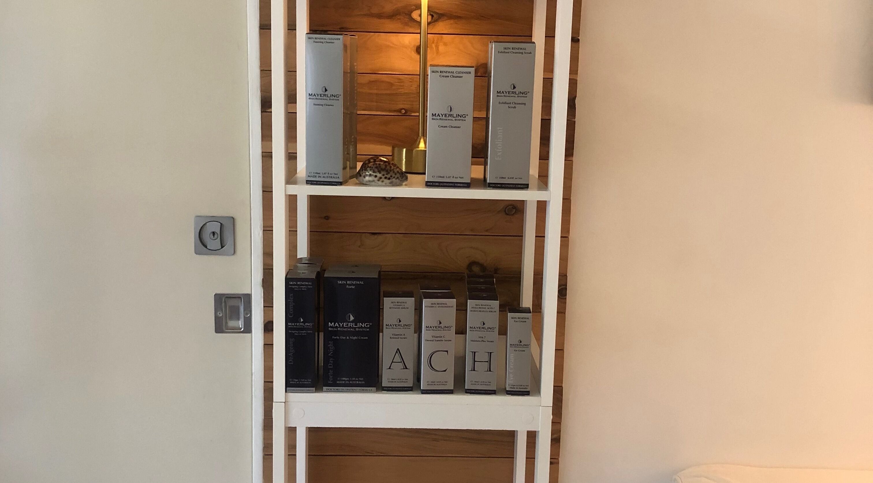 Skincare products neatly displayed at Beauty 2464, Yamba, New South Wales, AU, enhancing wellness ambiance.