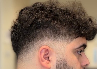 Side view of a trendy men's fade haircut at London Made Paris, London, England, GB.