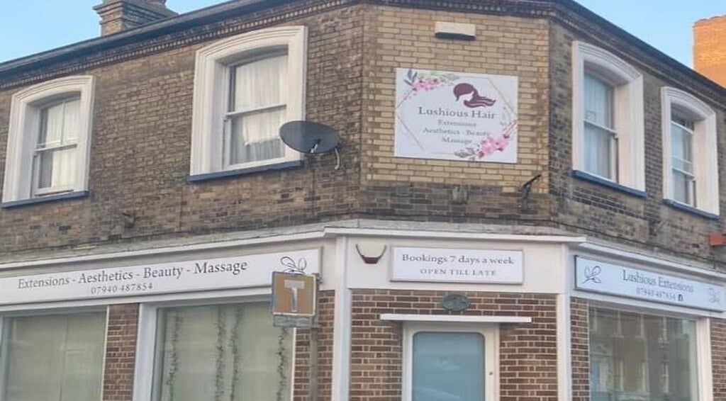Exterior of Hair By Molly Amber in Lowestoft, England, GB featuring elegant signage and brick facade.