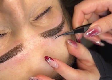 Close-up of eyebrow threading at Haus Of Features, Melbourne, Victoria, AU, showcasing skilled beauty techniques.