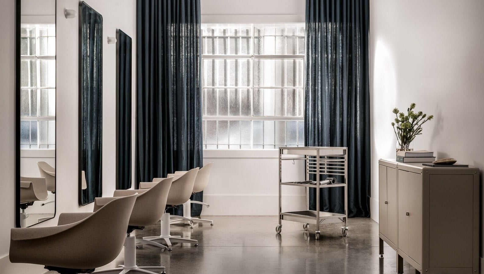 Sophisticated interior of HAIR EDIT by Chloe in Melbourne, Victoria, AU with sleek modern chairs and decor.