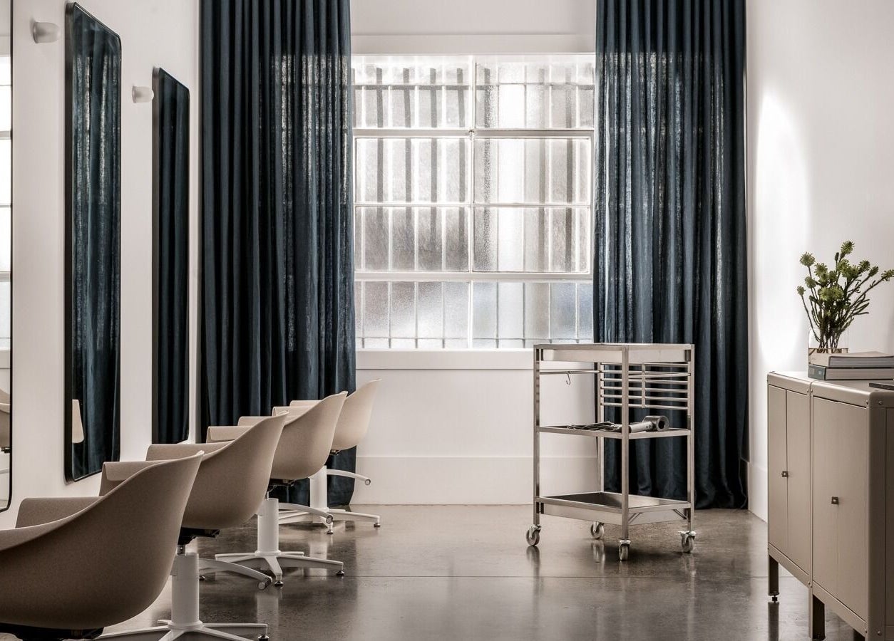 Sophisticated interior of HAIR EDIT by Chloe in Melbourne, Victoria, AU with sleek modern chairs and decor.