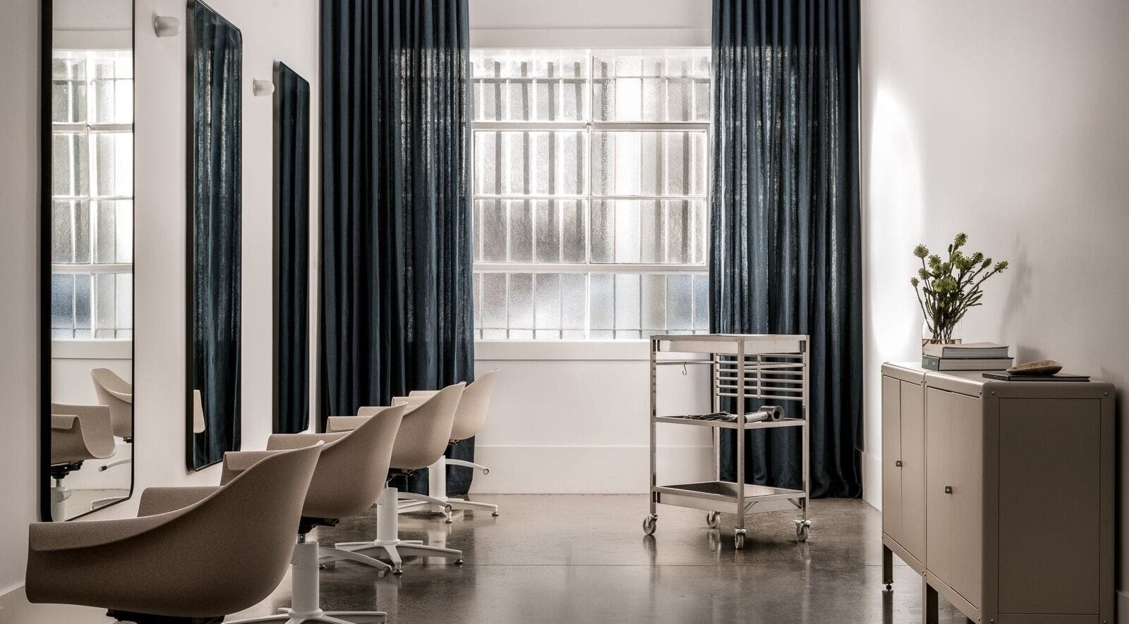 Sophisticated interior of HAIR EDIT by Chloe in Melbourne, Victoria, AU with sleek modern chairs and decor.