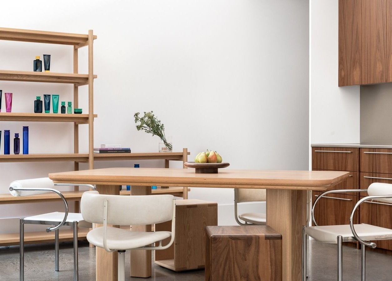 Elegant beauty salon interior at HAIR EDIT by Chloe, Melbourne, Victoria, AU with wooden decor and sleek shelves.