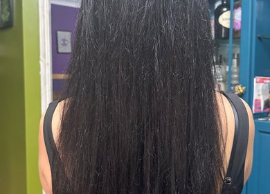 Smooth, straight hair seen from the back, styled at Whimsy Locs, Tuffley, England, GB.