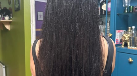 Smooth, straight hair seen from the back, styled at Whimsy Locs, Tuffley, England, GB.