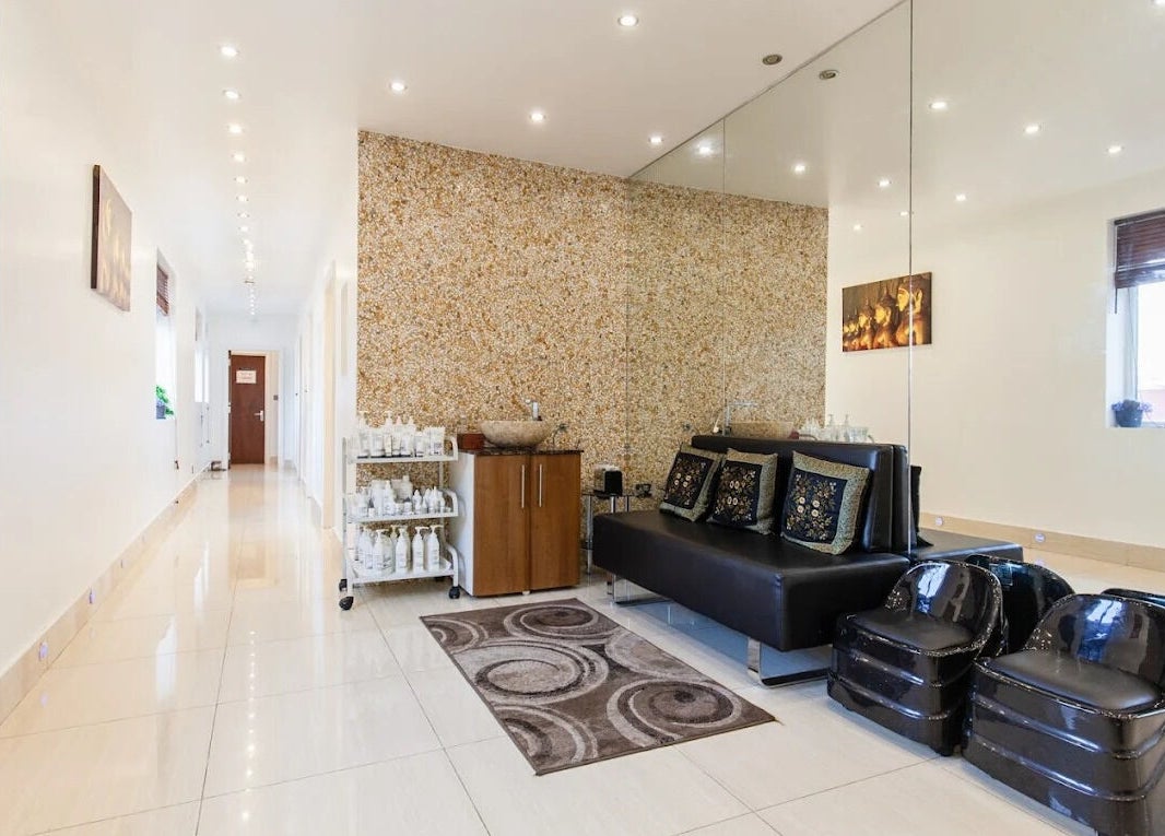 Elegant lounge area at Ambiance Beauty, Hounslow, England, GB, showcasing chic decor and plush seating.