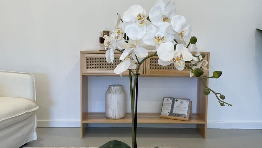 Elegant white orchids at Serenity Wellness Clinic, Subiaco, Western Australia, AU, inviting tranquility.