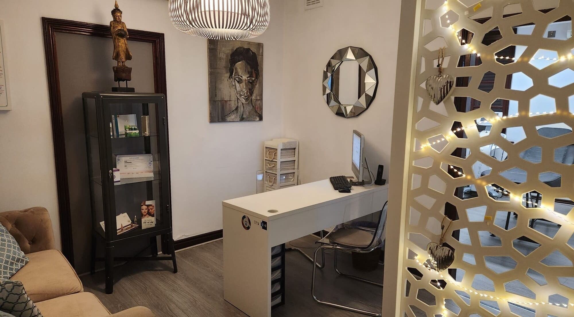 Welcoming reception at Bybu Aesthetics and Wellness, Gibraltar, GI, featuring elegant decor and artwork.