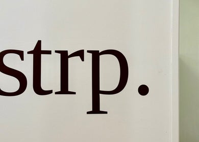 Strp. logo on white background in Edinburgh, Scotland, GB; sleek signage for beauty and wellness.