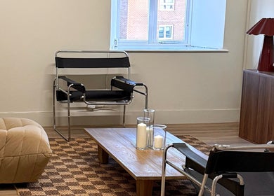 Relaxing minimalist lounge area at strp. in Edinburgh, Scotland, GB featuring modern chairs and decor.