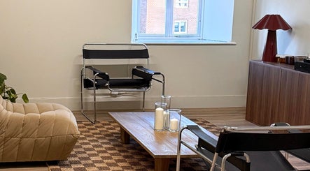 Relaxing minimalist lounge area at strp. in Edinburgh, Scotland, GB featuring modern chairs and decor.