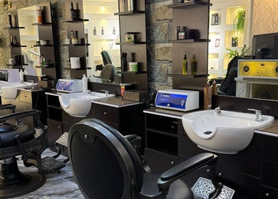 Modern barber chairs and styling stations at 700 Gents Salon - Voco, Dubai, Dubai, AE.