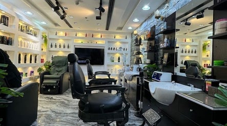 Chic interior of 700 Gents Salon - Voco, Dubai, Dubai, AE with stylish chairs and washbasin station.