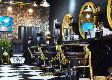 Elegant interior of 700 Gents Salon - Jumeirah in Dubai, Dubai, AE featuring opulent styling chairs and decor.
