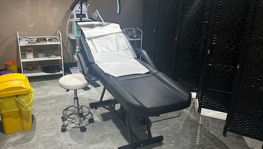 Cozy treatment room at Sogoli Studio, Manchester, England, GB, featuring a comfortable therapy chair.