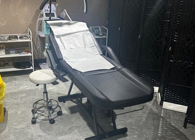 Cozy treatment room at Sogoli Studio, Manchester, England, GB, featuring a comfortable therapy chair.