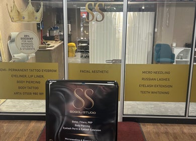 Entrance of Sogoli Studio in Manchester, England, GB showcasing beauty services signage.
