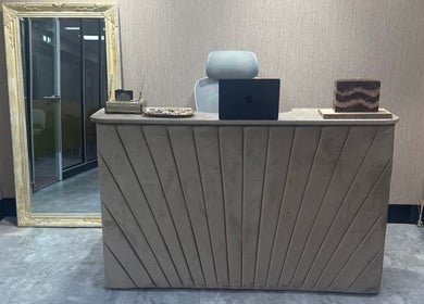 Elegant reception desk and mirror at Sogoli Studio, Manchester, England, GB.