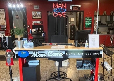 Reception desk at The Man Cave - Belle Vernon, showcasing stylish interiors in Belle Vernon, Pennsylvania, US.
