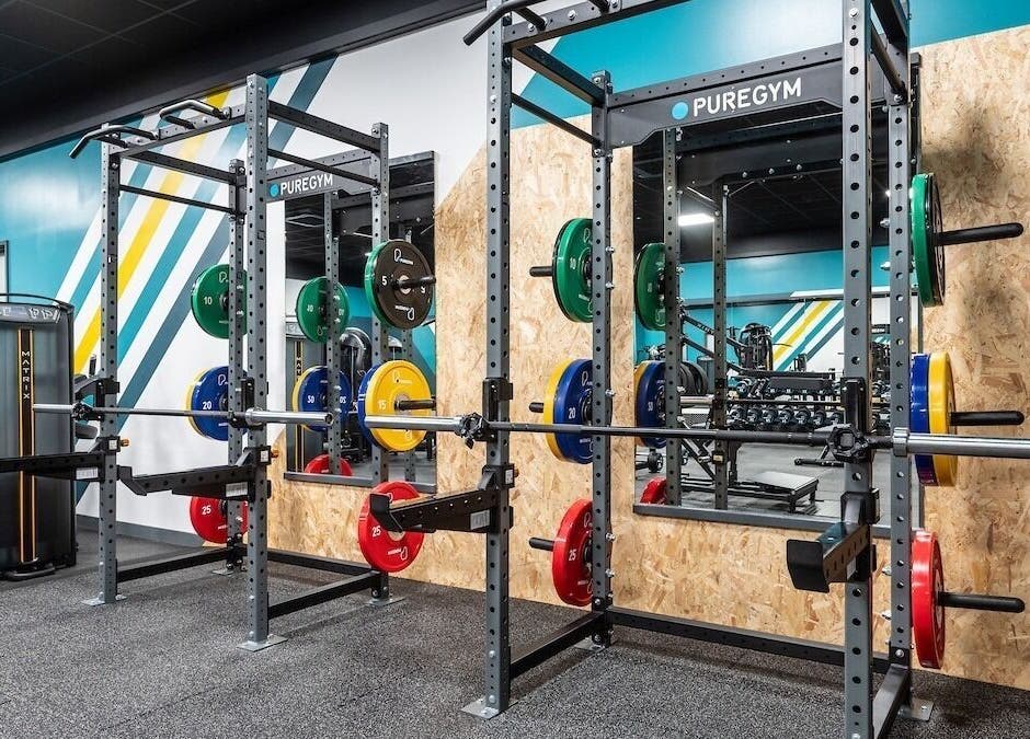 Vibrant gym setup at Fit With Pheebs, Weston-super-Mare, England, featuring colorful weight racks.