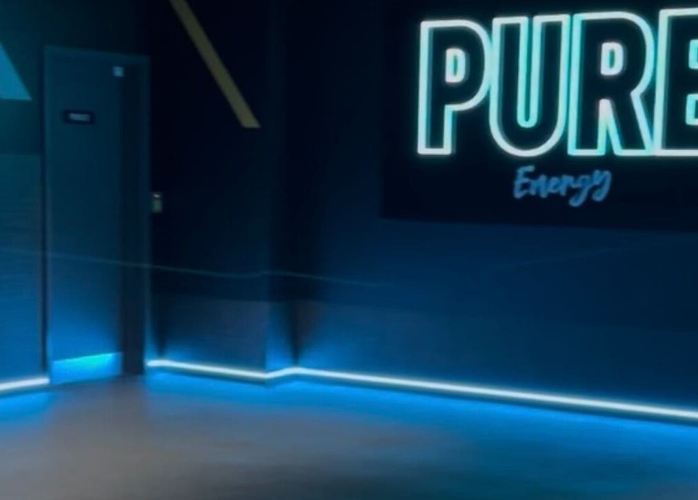 Blue neon-lit fitness room at Fit With Pheebs in Weston-super-mare, England, GB for energizing workouts.
