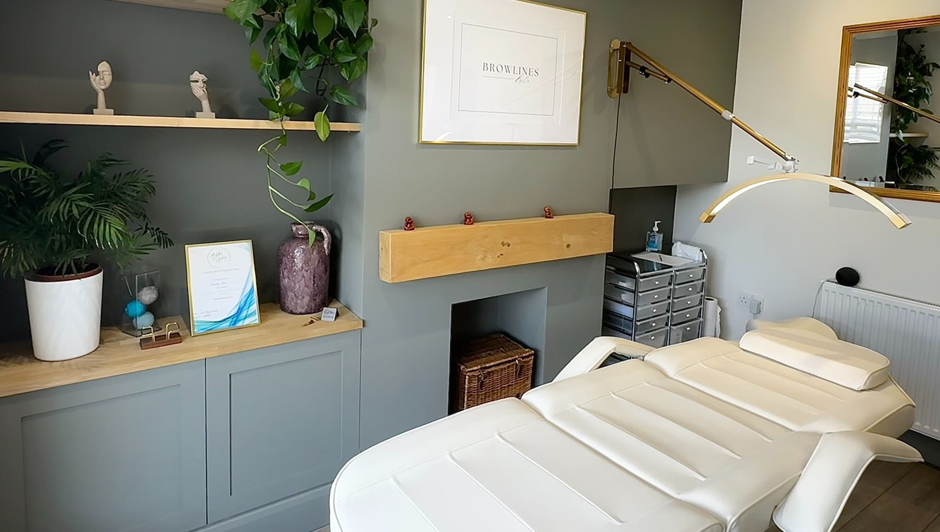 Calm therapy room at Browlines By Em, Welwyn Garden City, England, GB, featuring elegant decor and treatment bed.
