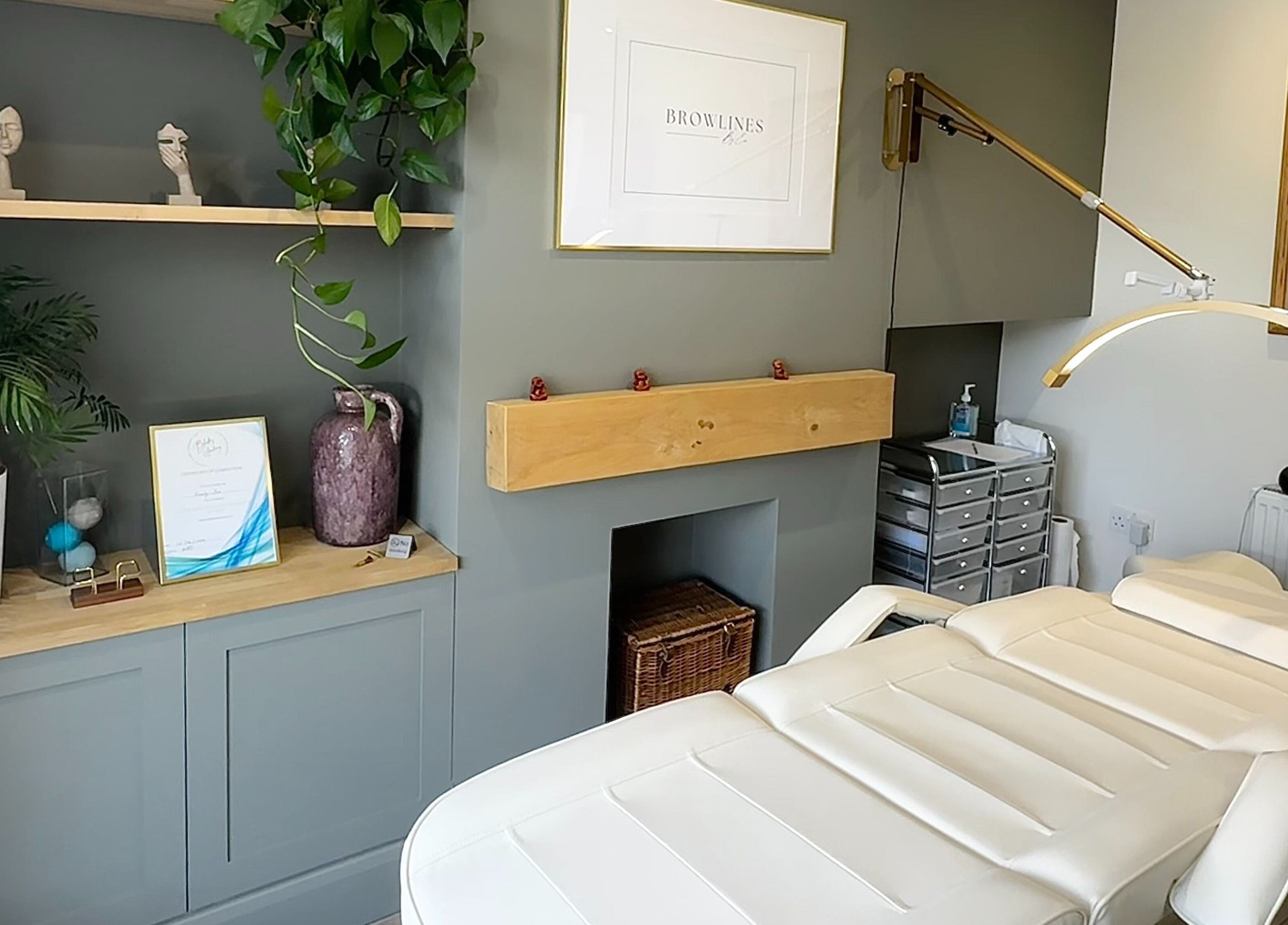 Calm therapy room at Browlines By Em, Welwyn Garden City, England, GB, featuring elegant decor and treatment bed.