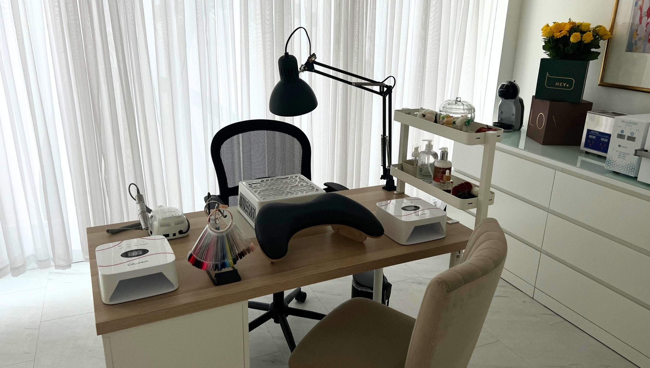 Elegant nail station at The Nail Muse by Tasha in Carlisle, England, GB, showcasing beauty tools and a cozy setup.