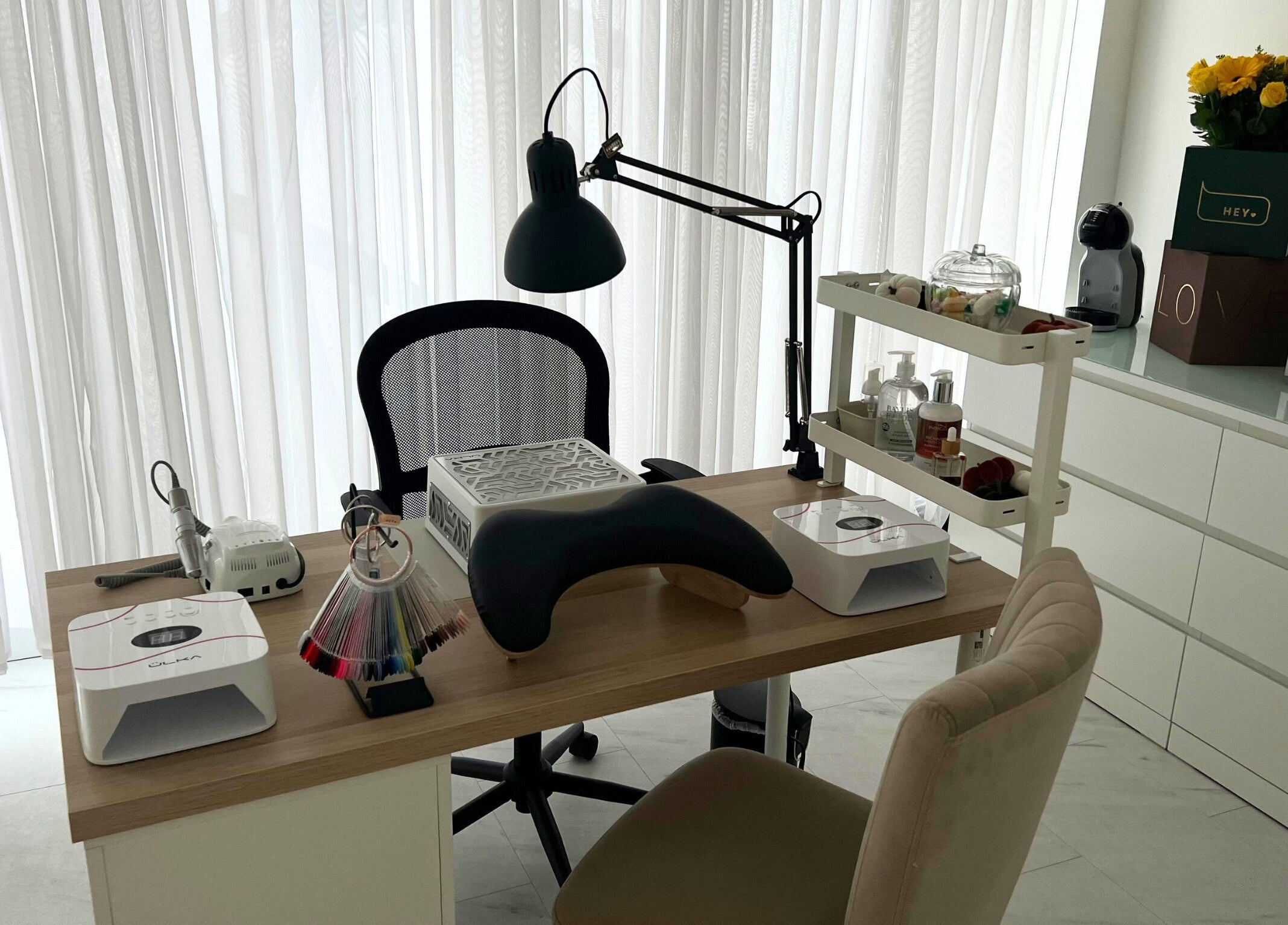 Elegant nail station at The Nail Muse by Tasha in Carlisle, England, GB, showcasing beauty tools and a cozy setup.